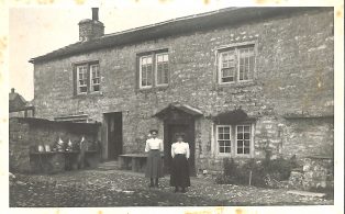 Photograph of two Un-named Women Outside Rowe End Farm