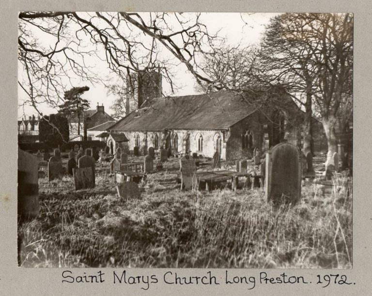 St Mary's Church Long Preston with view to houses in Church Street