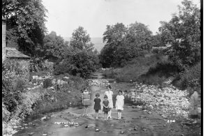 Children standing in a beck at Kettlewell